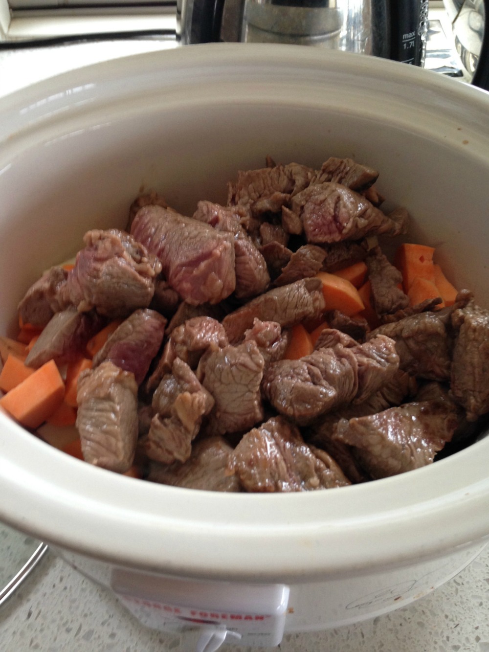 Browned beef added to cooker