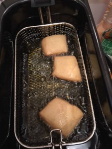 Deep frying the beignet dough