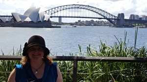 Cathryn Hein at Sydney Harbour with the bridge and Opera House in the background